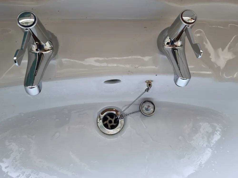 New chrome basin taps after replacement